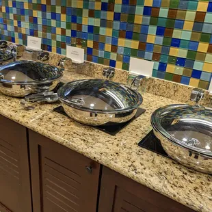 Several hot dishes, including mini quiche, turkey sausage, and biscuits and gravy