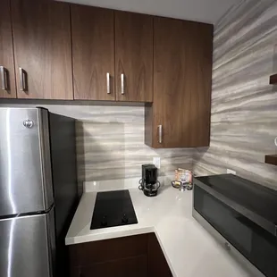 Cabinet, stove and microwave area