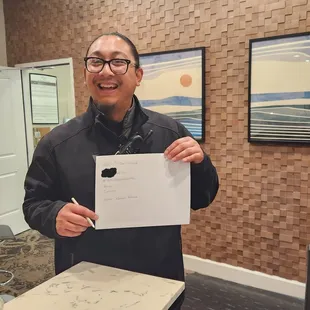 Carlson, the Valet guy holding the hand-written notes stating that Asme overcharged $630.