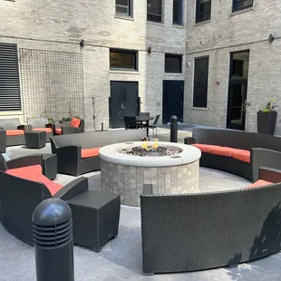 Outdoor sitting area with fireplace.