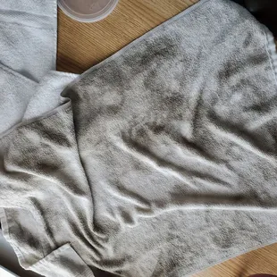This black towel was wiped damp across the kitchen floor in 5 min. It was a white towel