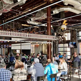 a large group of people sitting at tables