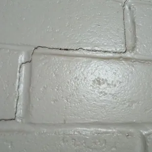 Room wall caving in structural damage