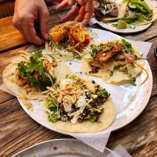 Front: Brussels Sprouts Right: Duck Confit Back: Shrimp Tempura  Left: Pecan Smoked Chicken