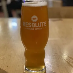 a glass of beer on a table