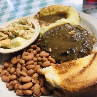 Hamburger steak, pinto beans, banana pudding, mashed potatoes and gravy