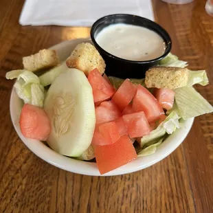 a plate of salad with dressing