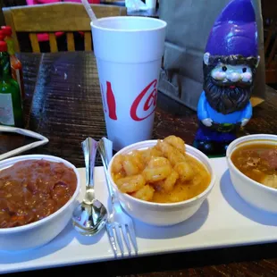 three bowls of food on a table