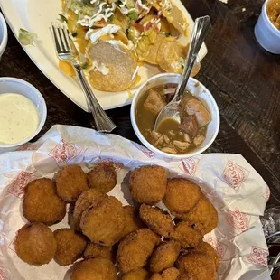 Fried pickles, nachos and sampler. Red beans and rice were good along the the étouffée.