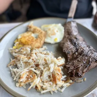 Steaks and eggs with hash browns