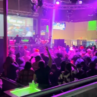 a crowd of people at a party