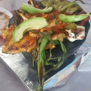 It&apos;s a perfect marriage of chicken, carne asada, chorizo, no pales, veggies salsa and cheese.....perfect to share.