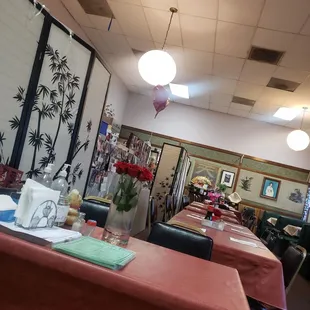 tables with pink tablecloths and red tablecloths