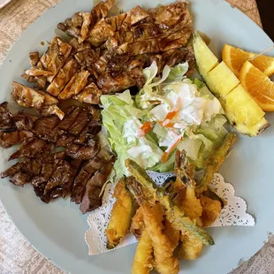The Family combination A: beef teriyaki, chicken teriyaki, tempura veggies and Shrimp, green salad, pineapple and orange wedges