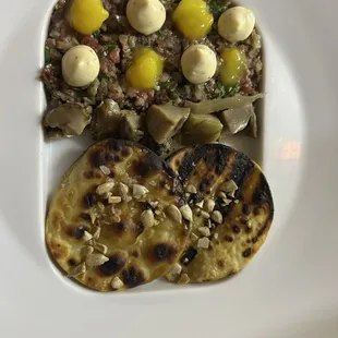 a plate of food with bread and eggs