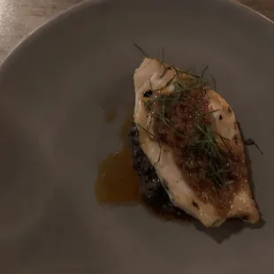 a piece of fish on a plate