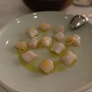 scallops in oil on a plate