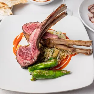 a plate of food with meat and vegetables