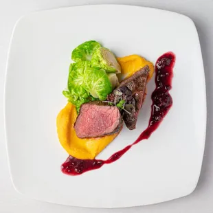 a plate of meat and vegetables