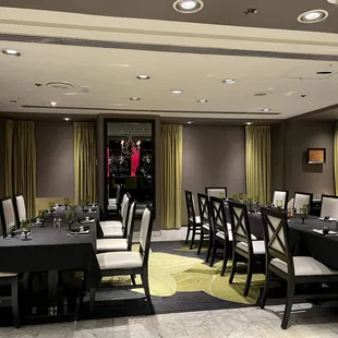 a dining room with tables and chairs