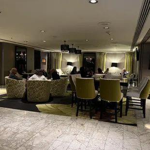 a group of people sitting around a table