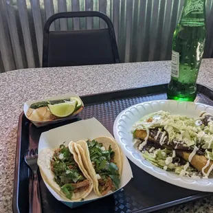 2 carnitas tacos and 3 rolled beef tacos.