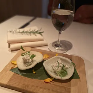 a plate of food and a glass of wine