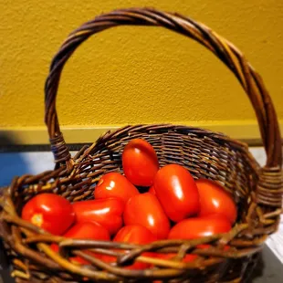 a basket full of tomatoes