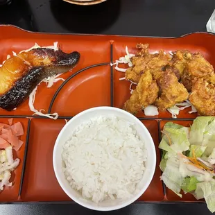 a plate of food and a bowl of rice