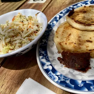 Chicharrón pupusa, revuelta pupusa and curtido.