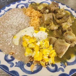 Green Chile with big pieces of pork costillas and addition huevo on the side! creamy, great tasting beans and rice.