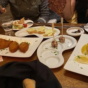 a table full of food and drinks