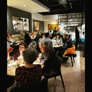 a group of people sitting at a table