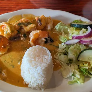 a plate of food with rice and vegetables