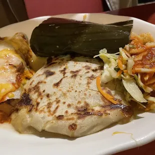 Trio with enchilada, pork puspusa, and chicken tamale