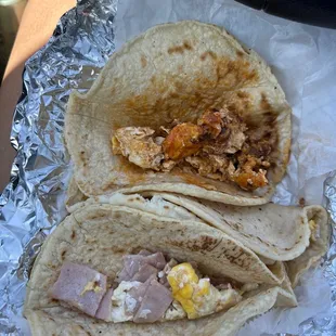 two tacos with meat and eggs