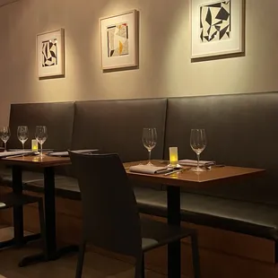 a row of tables with wine glasses on them