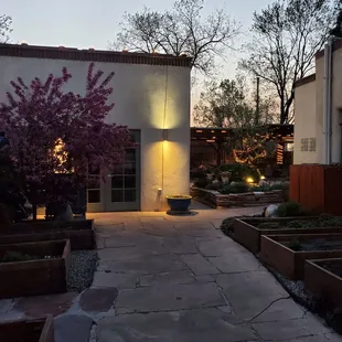 a patio area with seating and lighting