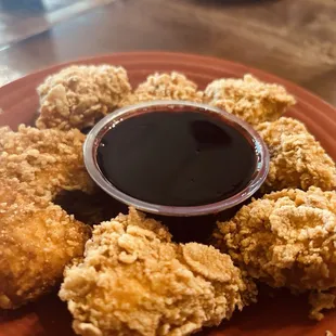 Cheese fried in corn flakes with yummy blueberry sauce