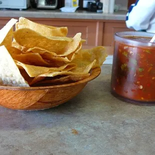 Fresh tortilla chips and mild red sauce