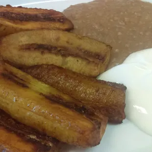 Fried plantains, refried beans and creme fraiche