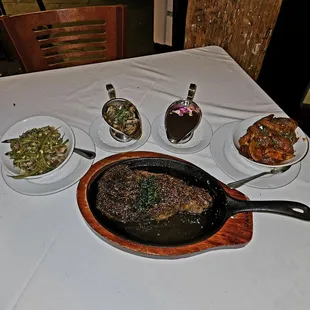 Rib eye steak, fingerling potatoes, and green beans, homemade steak sauce