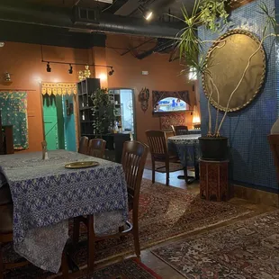 a dining room with a table and chairs