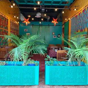 Looking from the front sidewalk into the semi open-air garden room