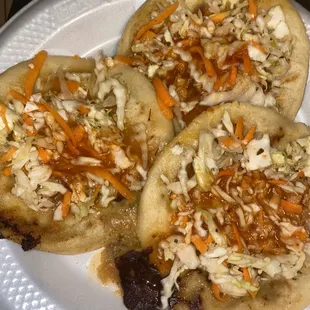 three small pizzas on a plate
