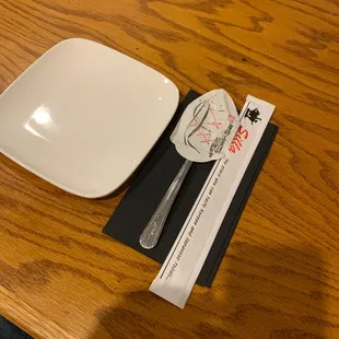 a plate, fork and knife on a table