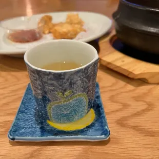 a cup of tea and a plate of food