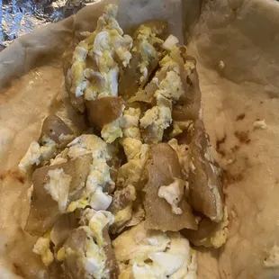 Ordered with cheese, but no cheese, and look how dry the potatoes are.