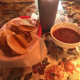 a plate of chips and a drink