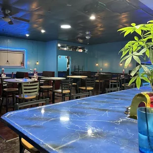 a blue table and chairs